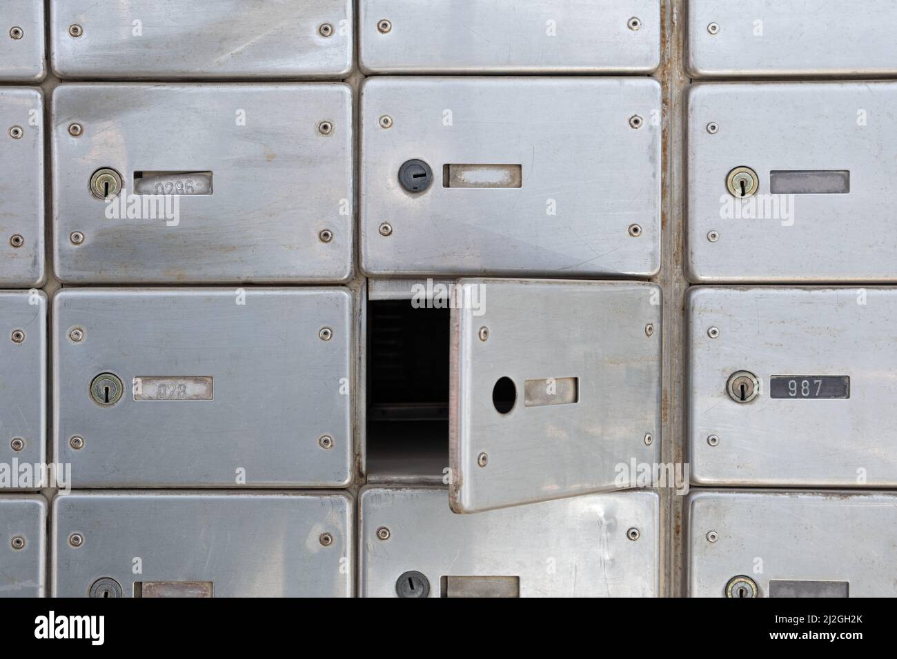 Damaged lock P.O Mailbox hack in the Post Office. Rows of aged