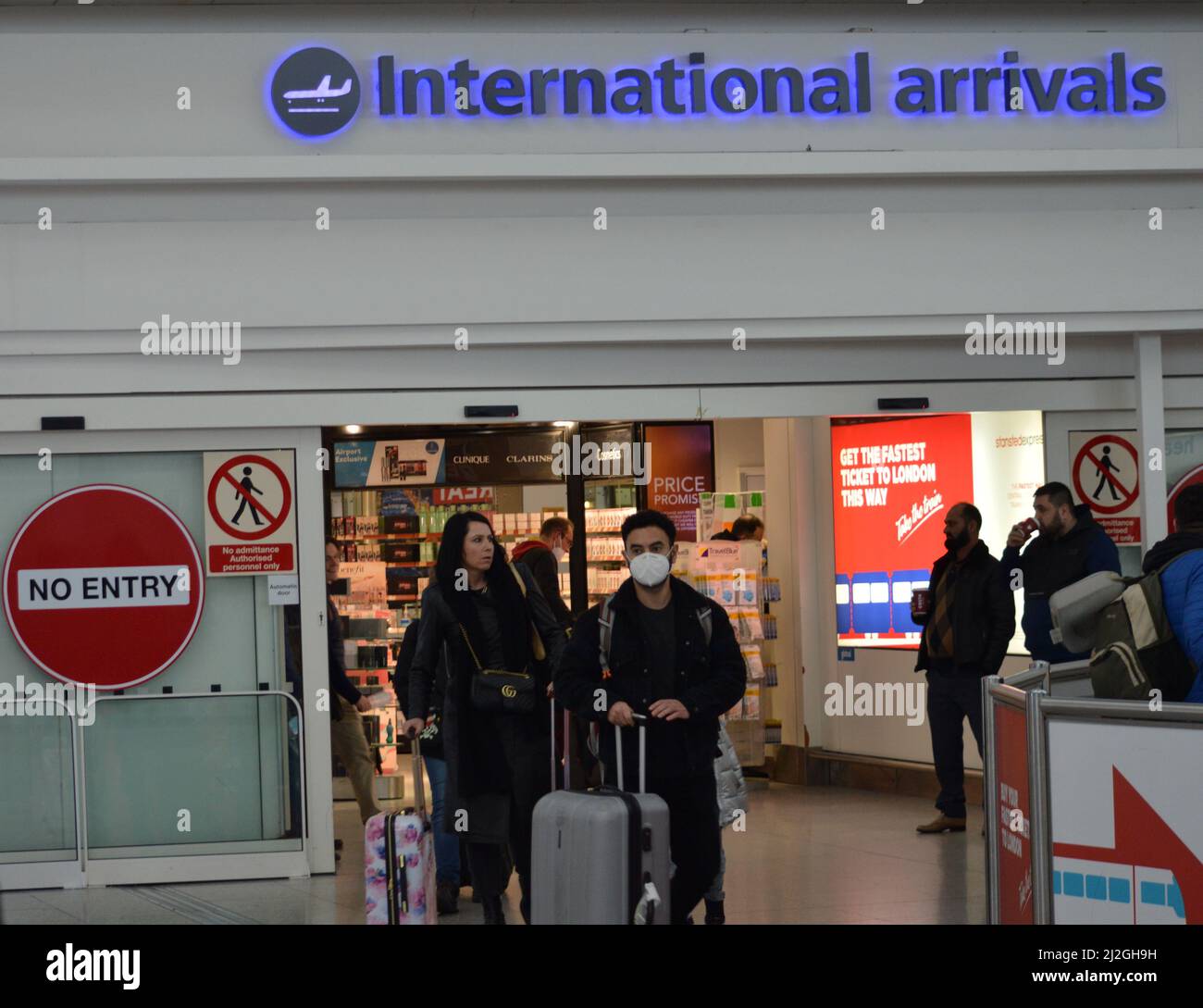 Passengers arrive to the UK after the government announces that from the 18th of March, Passenger Locator Forms are no longer required for UK arrivals. Stock Photo