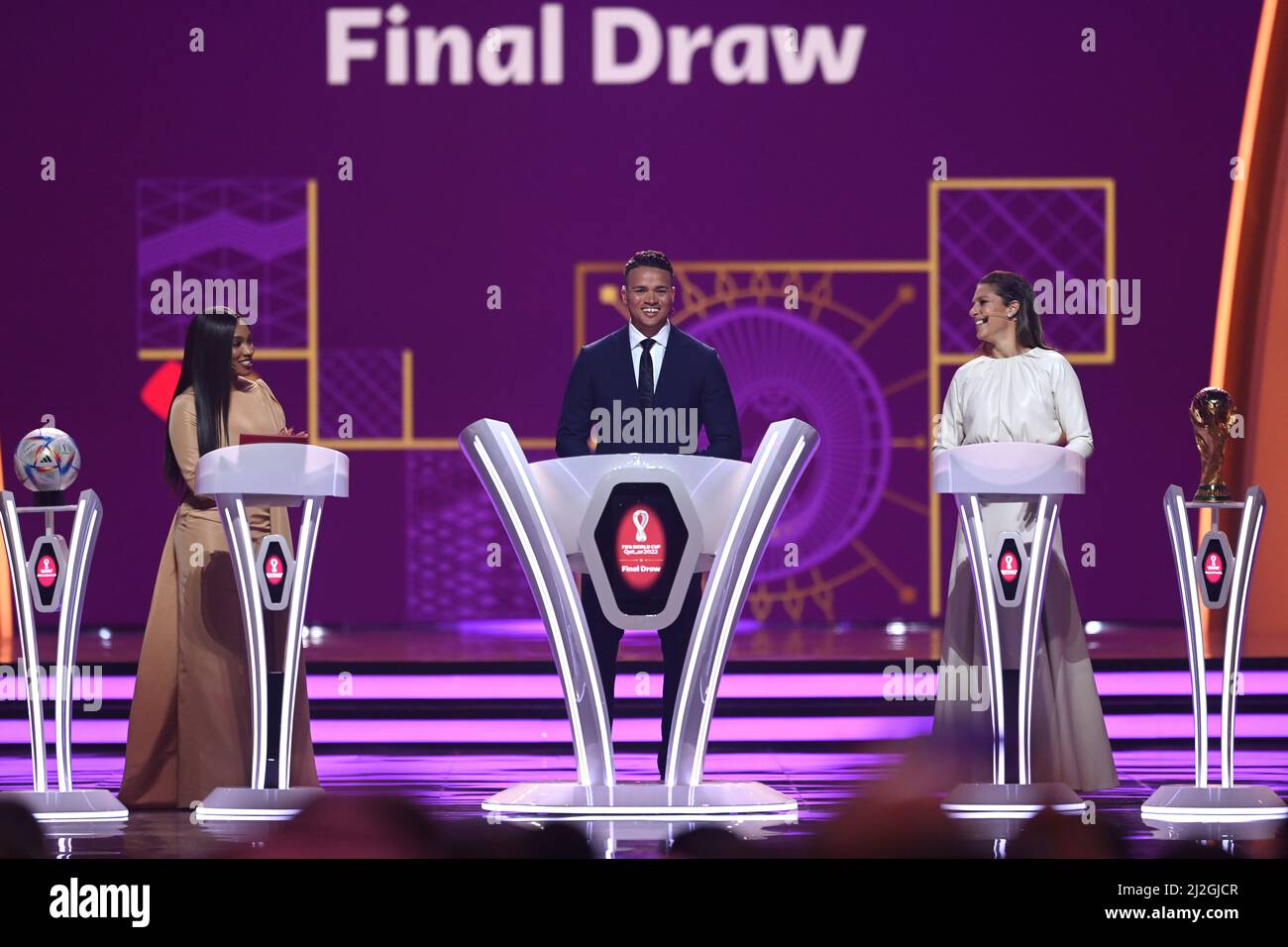 DOHA, QATAR - APRIL 01: Samantha Johnson (L),  Jermain Jenas (C) and Carli Lloyd (R) are seen on stage during the FIFA World Cup Qatar 2022 Final Draw at the Doha Exhibition Center on April 01, 2022 in Doha, Qatar. (Photo by Michael Regan/FIFA/Sipa USA)*** For Editorial Use Only *** Not to be Published in Books or Photo Books *** Handling Fee Only ***   Please note: Fees charged by the agency are for the agency's services only, and do not, nor are they intended to, convey to the user any ownership of Copyright in the material. You are only obtaining access to the agency’s digital copy and are Stock Photo