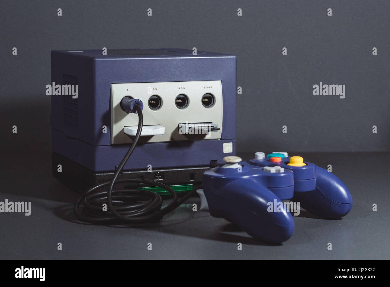 The Nintendo GameCube system with the GB Player attached at the bottom with a Pokemon Emerald cartridge Stock Photo