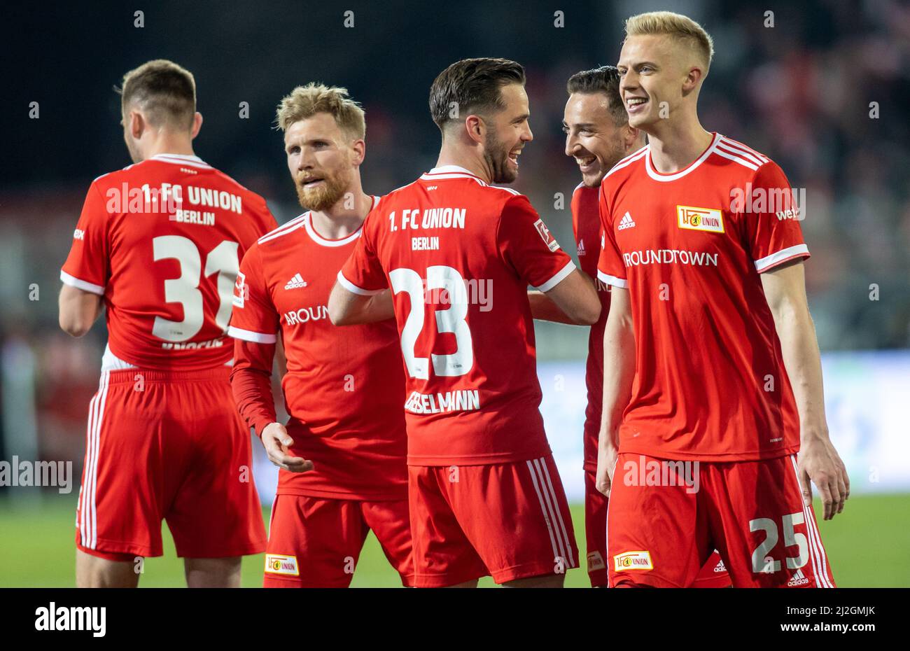 Berlin, Germany. 01st Apr, 2022. Soccer: Bundesliga, 1. FC Union Berlin - 1. FC Köln, Matchday 28, An der Alten Försterei. Berlin's Robin Knoche (l-r), Andreas Voglsammer, Niko Gießelmann, Kevin Möhwald and Timo Baumgartl high-five each other after the victory. Credit: Andreas Gora/dpa - IMPORTANT NOTE: In accordance with the requirements of the DFL Deutsche Fußball Liga and the DFB Deutscher Fußball-Bund, it is prohibited to use or have used photographs taken in the stadium and/or of the match in the form of sequence pictures and/or video-like photo series./dpa/Alamy Live News Stock Photo