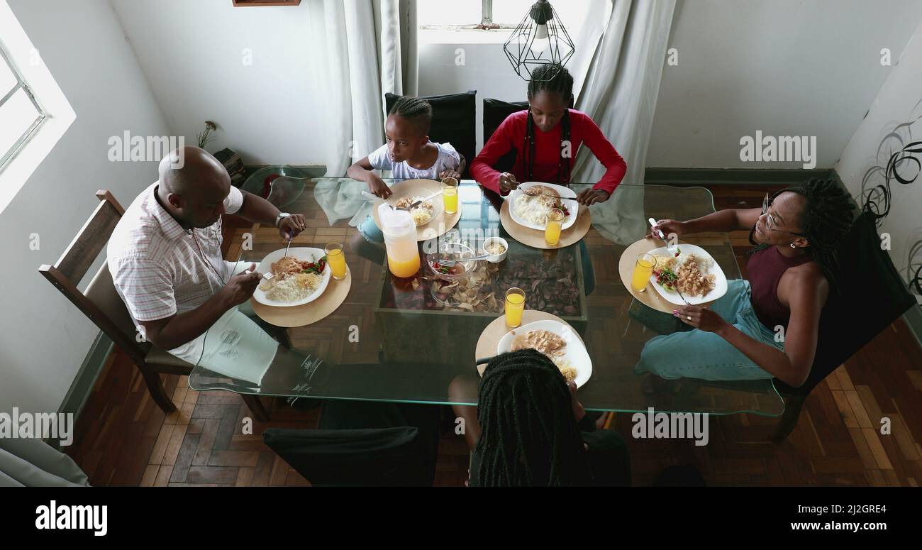 Black African family eating meal together, lunch time Stock Photo - Alamy