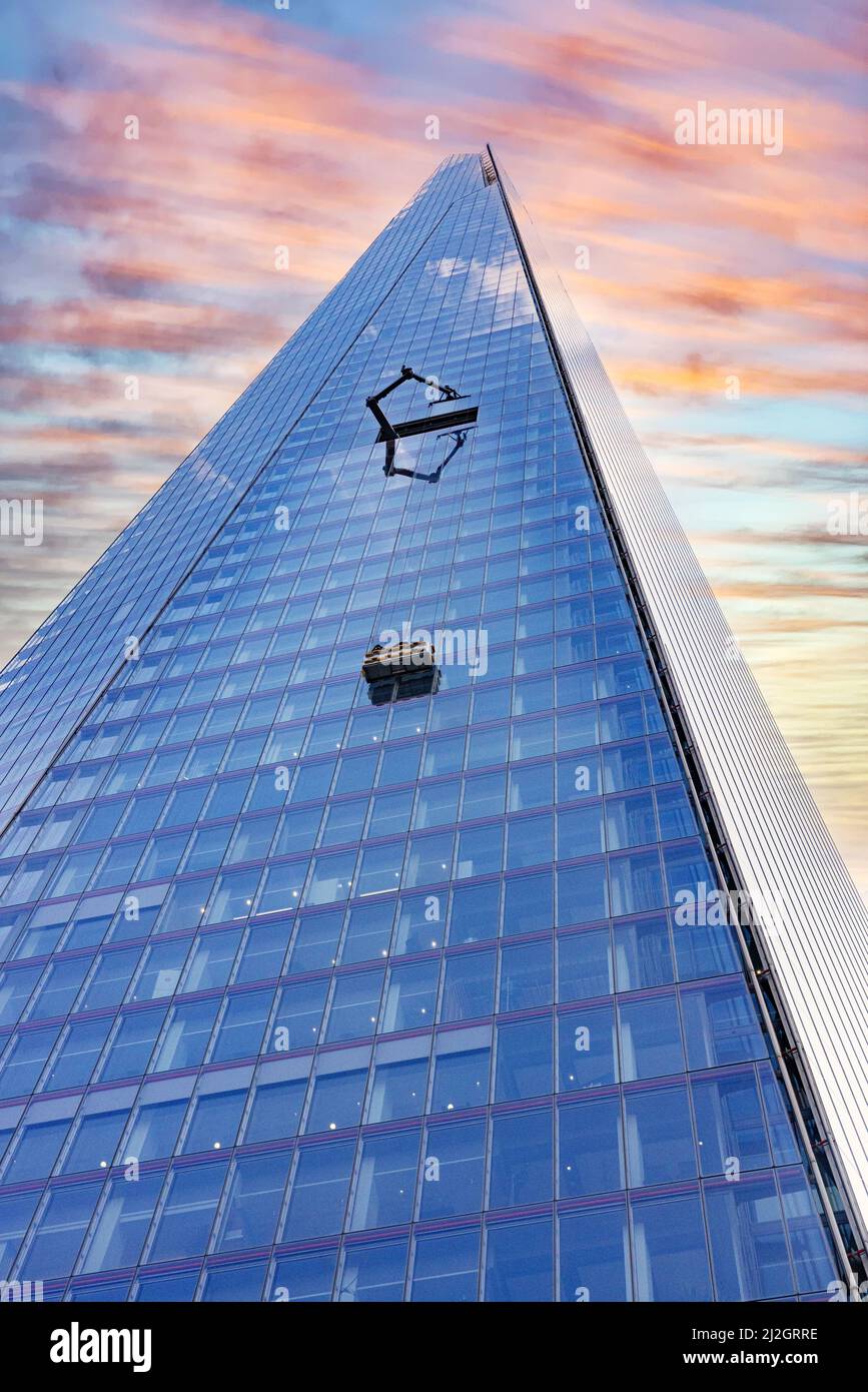 Concept; Futuristic city; The Shard London, looking up to a dramatic sky at sunset, London Shard skyscraper, Central London UK Stock Photo