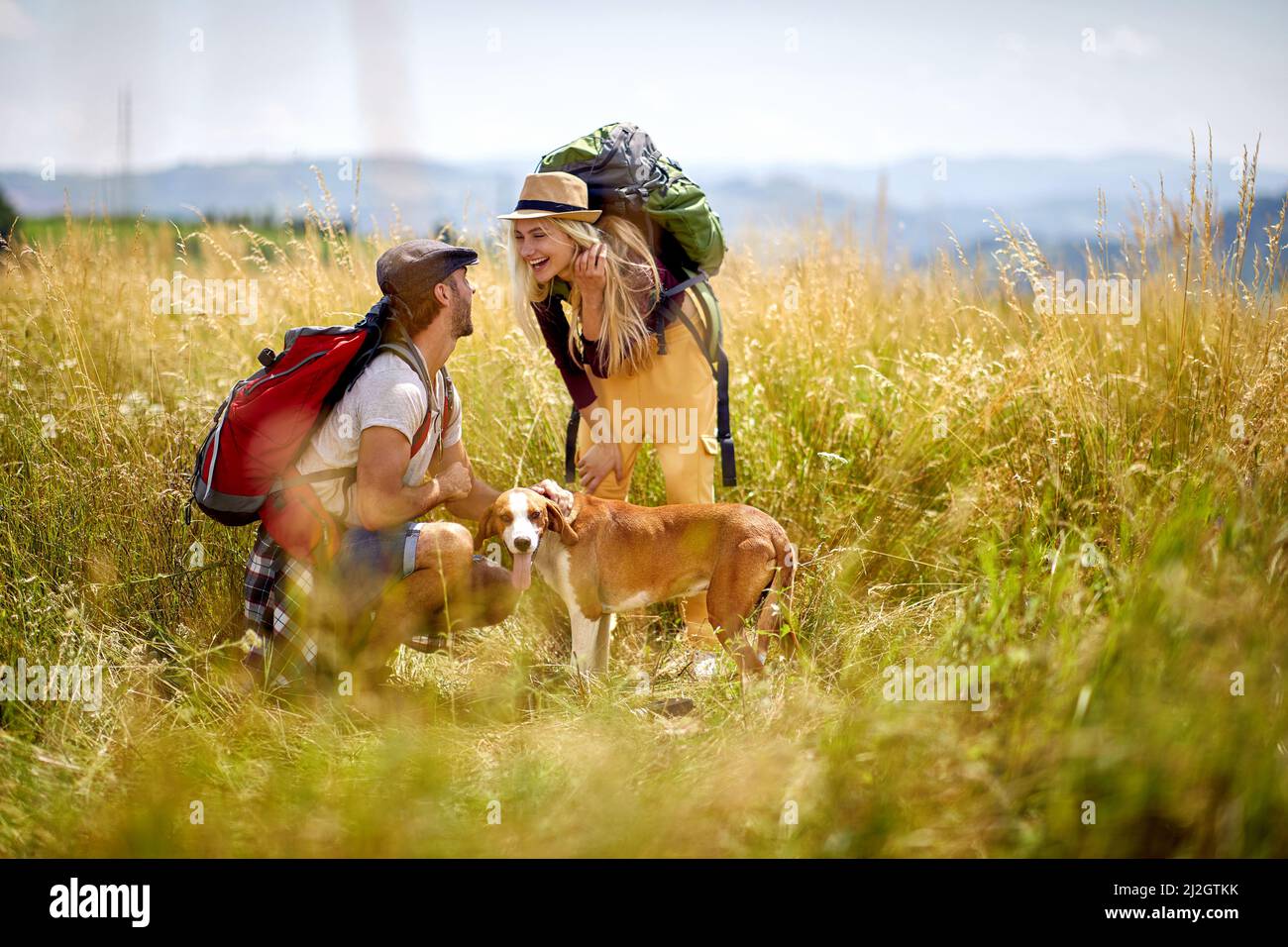 Freedom And love.smiling couple having fun with their dog Stock Photo