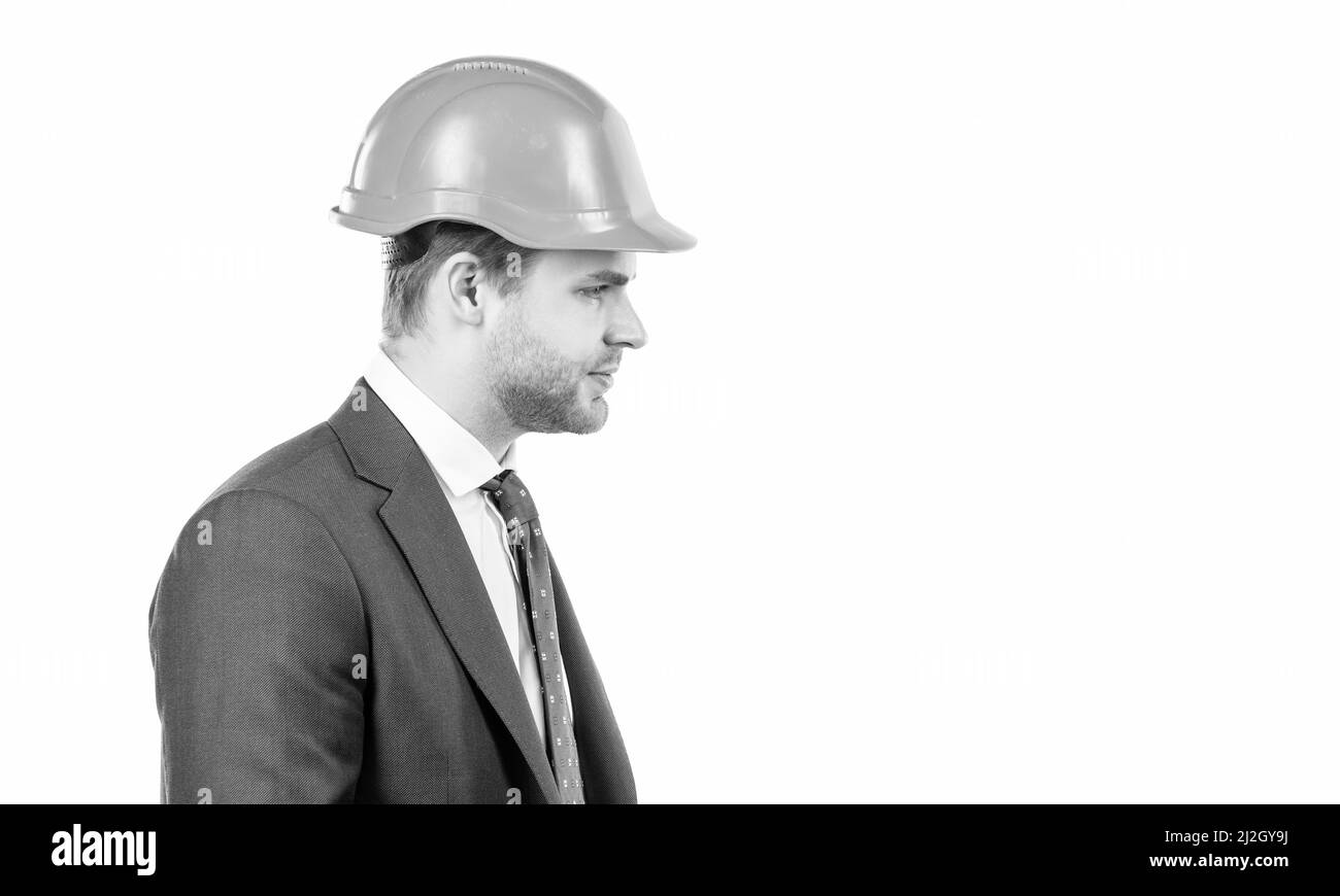 Profile portrait of professional man in hardhat and suit isolated on white, engineer Stock Photo