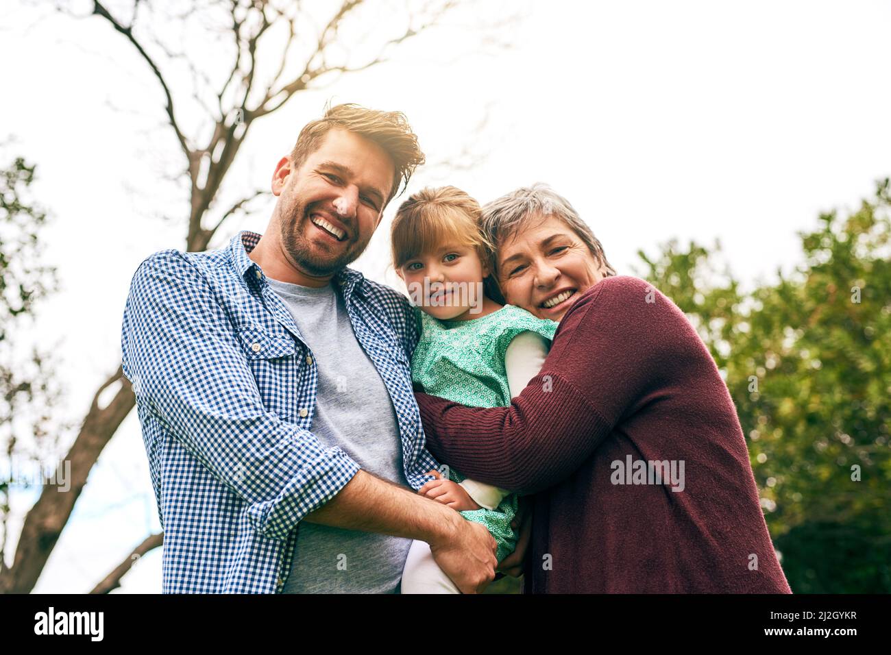 Embracing the love of family. Shot of a multigenerational family outside. Stock Photo