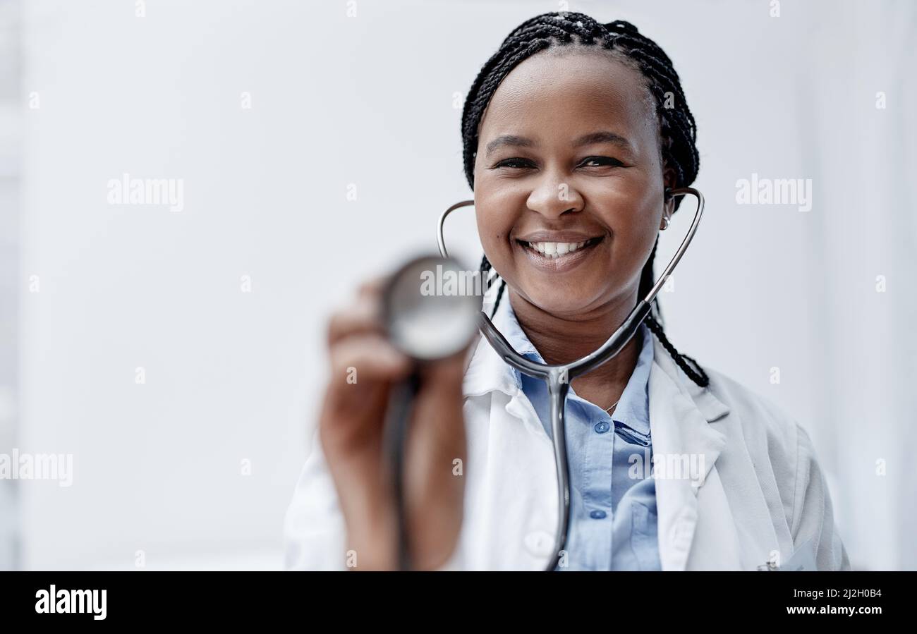 Making a real difference in the lives of others. Portrait of a young doctor holding a stethoscope. Stock Photo