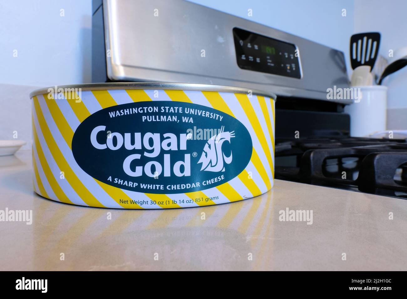 A tin can of Cougar Gold white cheddar cheese, made by the Washington