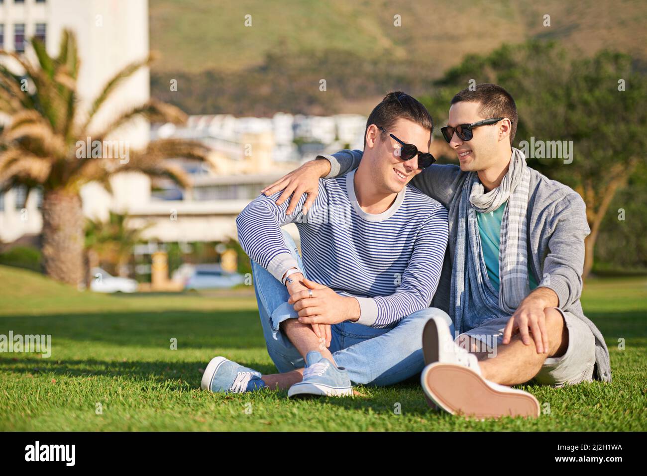 Another perfect day together. Shot of a young gay couple enjoying their day together outside. Stock Photo
