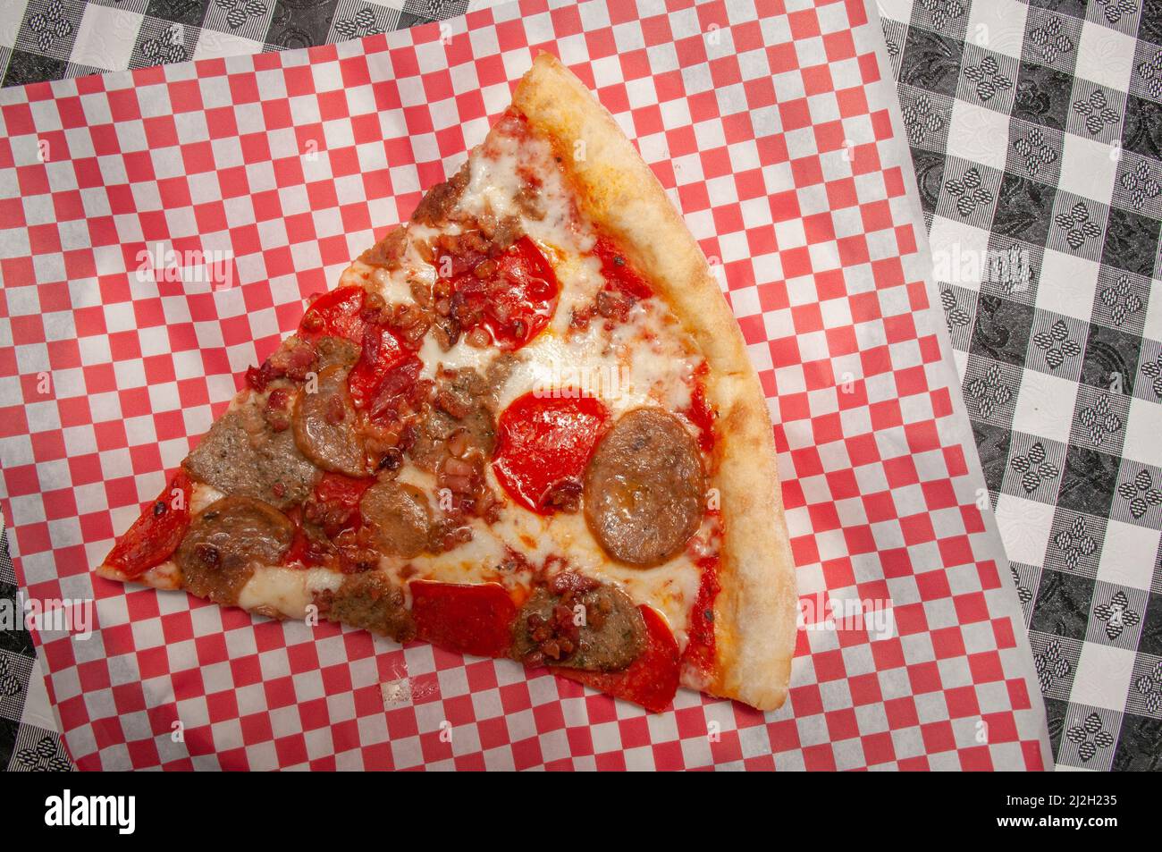 Delicious tomato sauce cheese covered hot and tasty meat lovers pizza pie Stock Photo Alamy