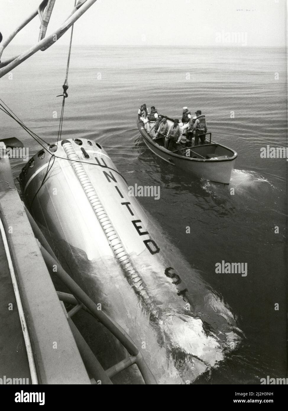 Recovery of part of the first stage of NASAs Gemini V Booster, the first to ever be retrieved from space was made by the U.S.S. Dupont. The booster was used to launch the Gemini 5 Spacecraft Stock Photo