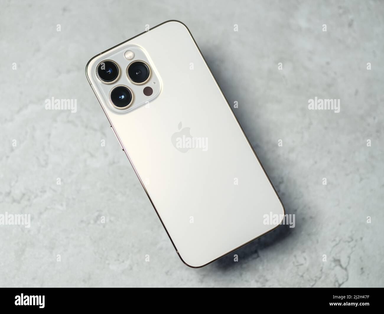 HCMC, Vietnam - August 19, 2021: View of new iPhone 13 or iPhone 13 Pro and Apple Airpods for editorial use Stock Photo