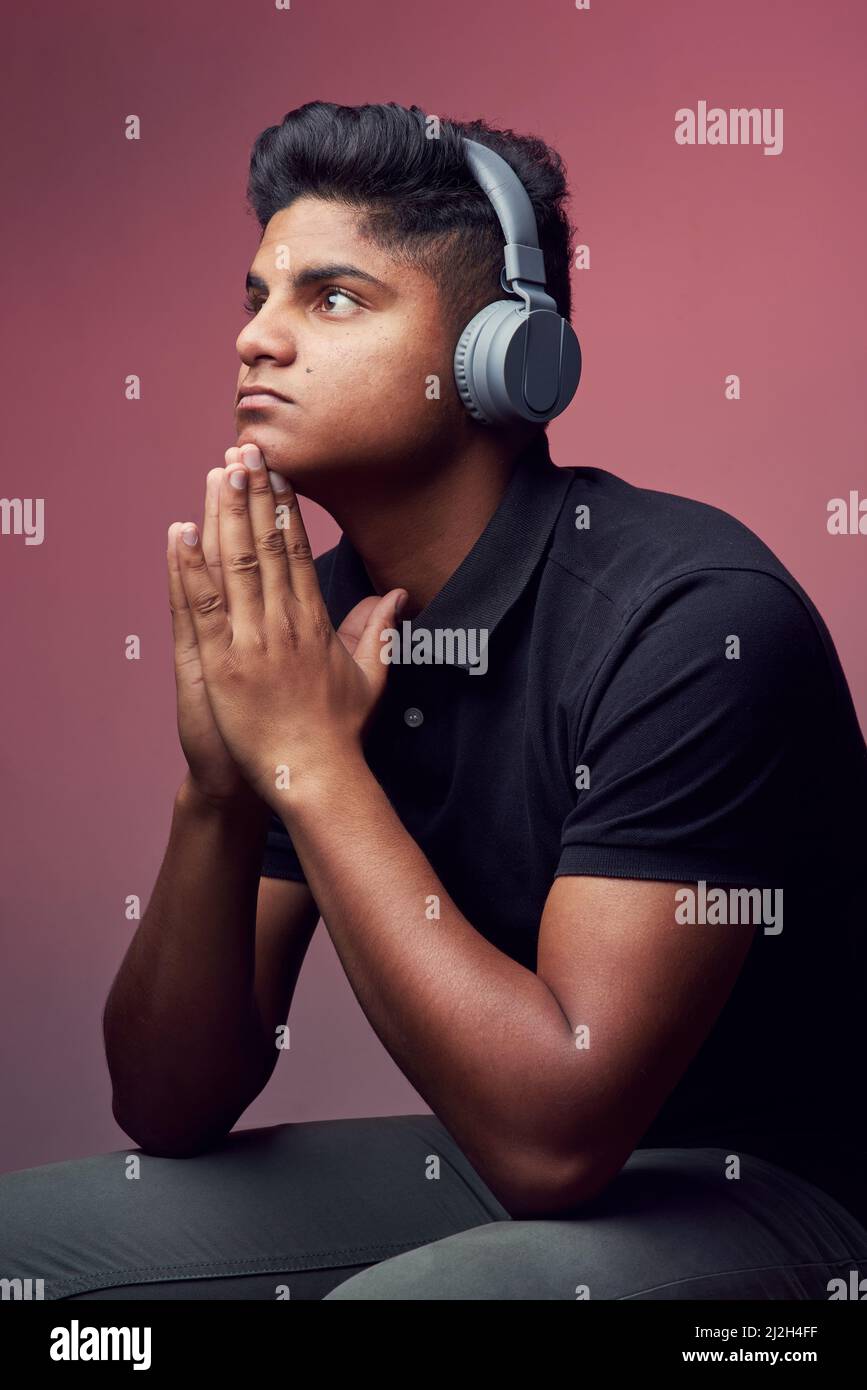 Indian young man wearing headphones hi-res stock photography and images ...