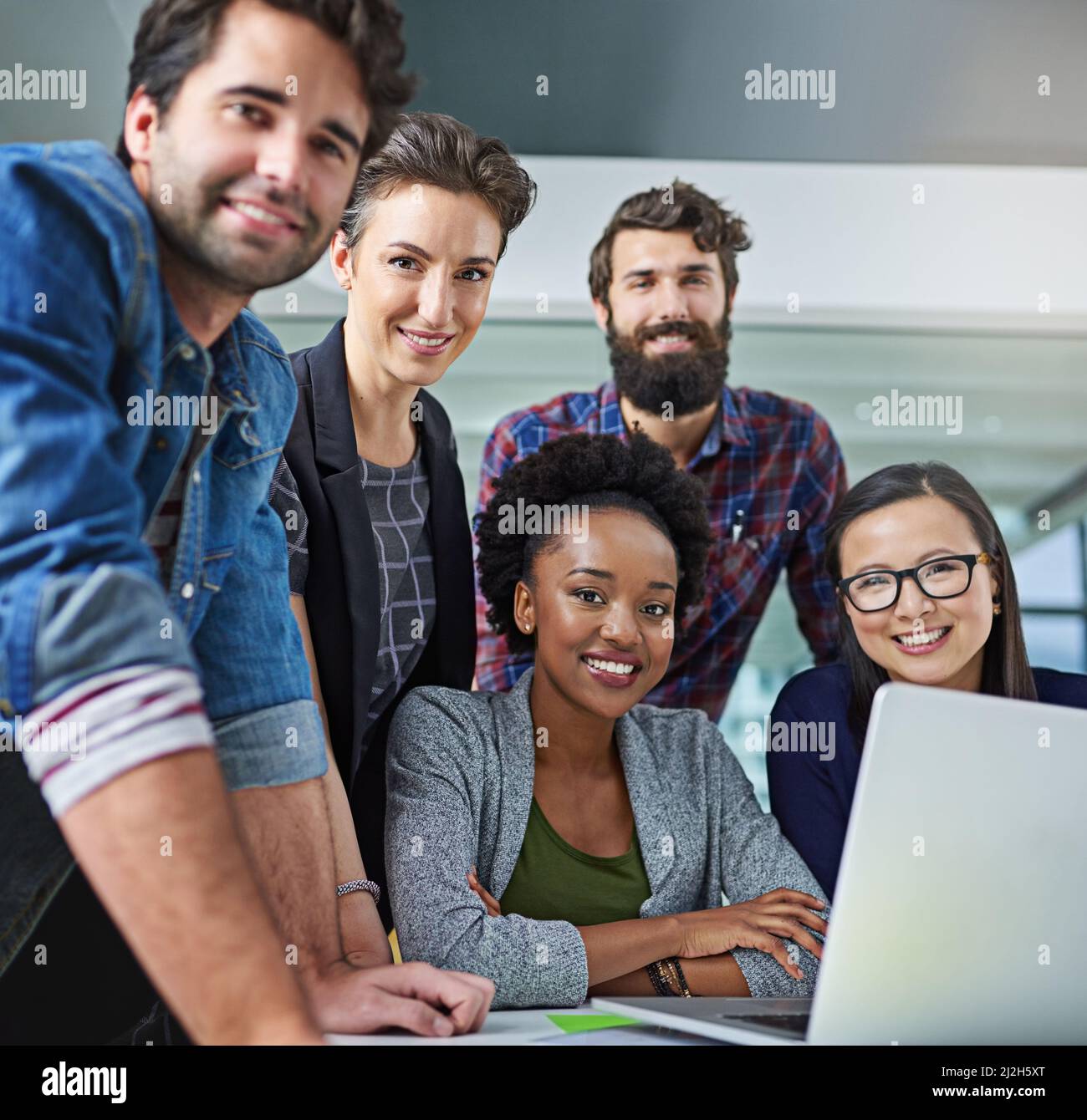 Smiling creative business team working hi-res stock photography and ...