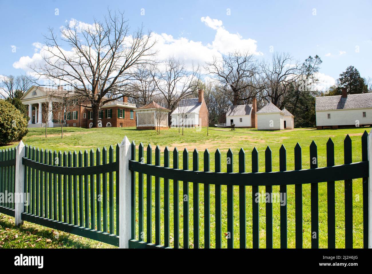 Montpelier Home of President James Madison & Dolley Madison. Enslaved homes. Reconstructed slavery quarters, South Yard. Picket fence. Caption space. Stock Photo