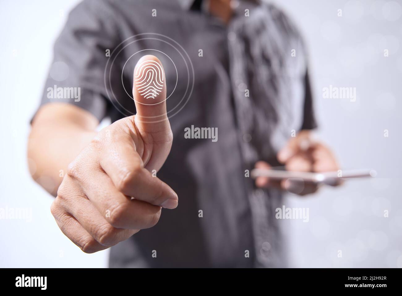 Man Shows Digital Processing Finger of the Future of Biometric Identification Fingerprint Scanner Personal Financial Data Access and digital program s Stock Photo