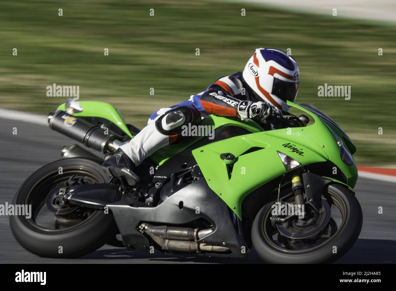 A racing sports motorbike on the track - Kawasaki Ninja Stock Photo