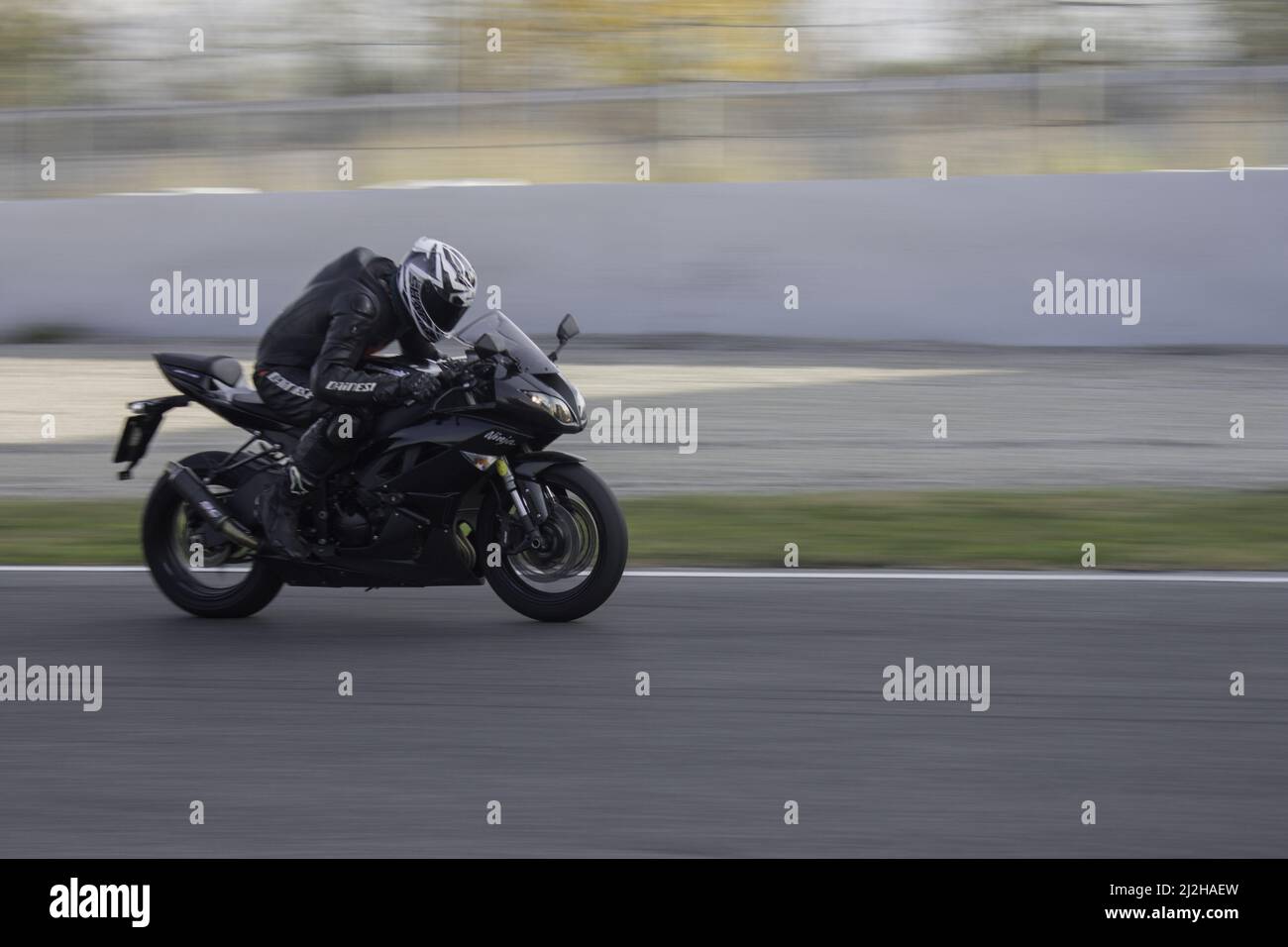 A racing sports motorbike on the track - Kawasaki Ninja Stock Photo