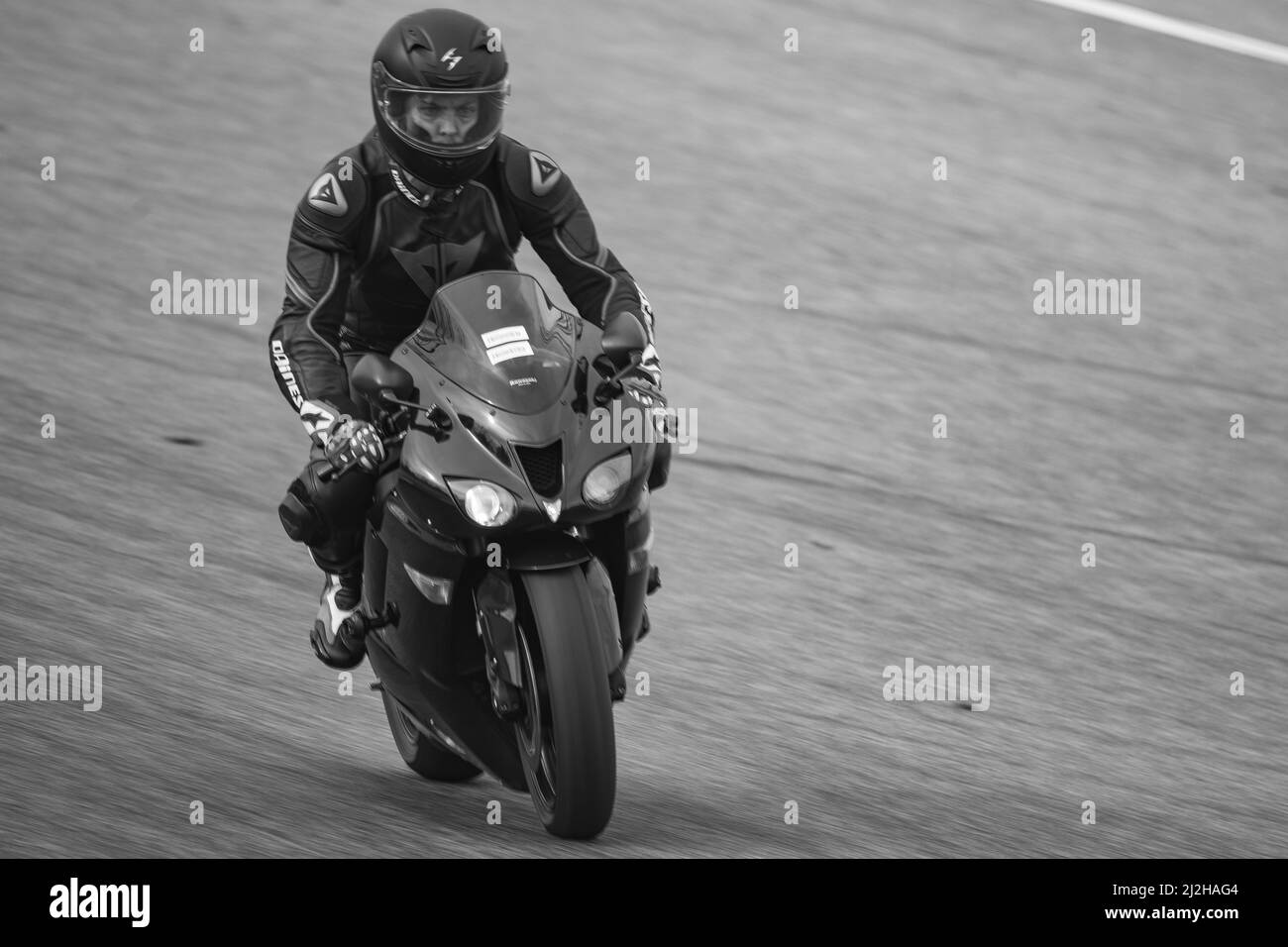 A racing sports motorbike on the track - Kawasaki Ninja Stock Photo