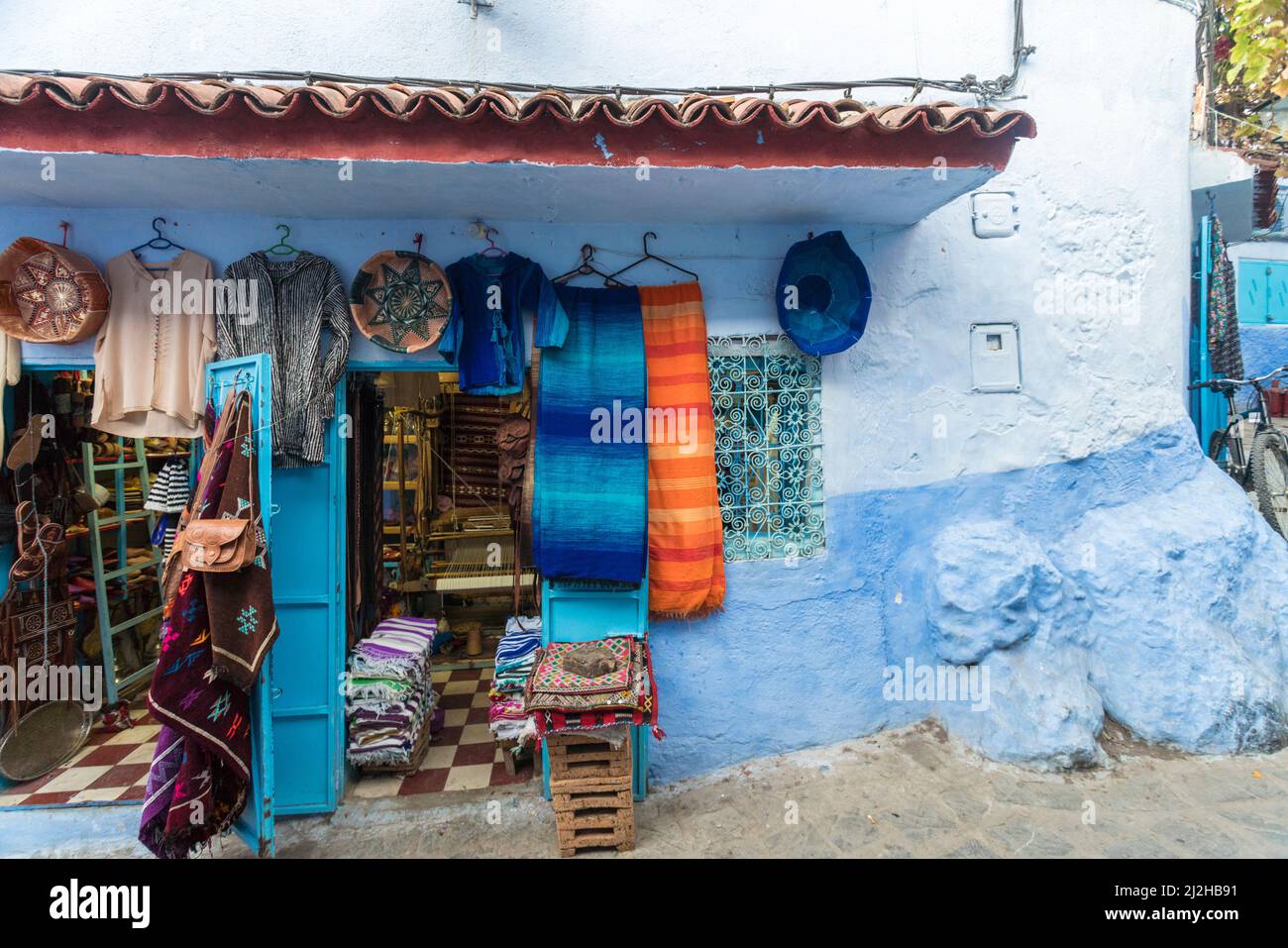 Morocco, Chefchaouen, Souvenirs for sale at traditional blue house