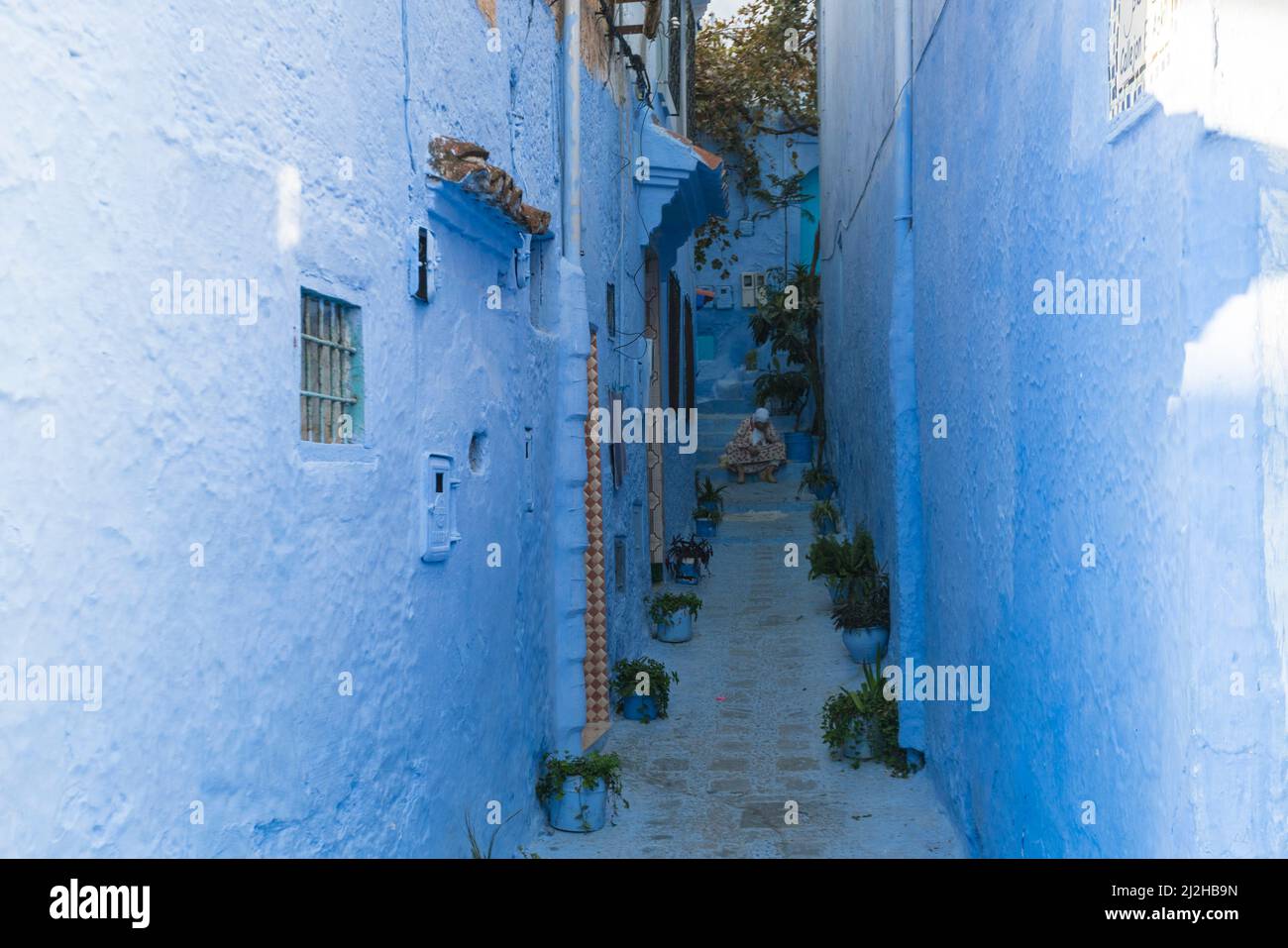 Morocco, Chefchaouen, Narrow alley and traditional blue houses Stock Photo