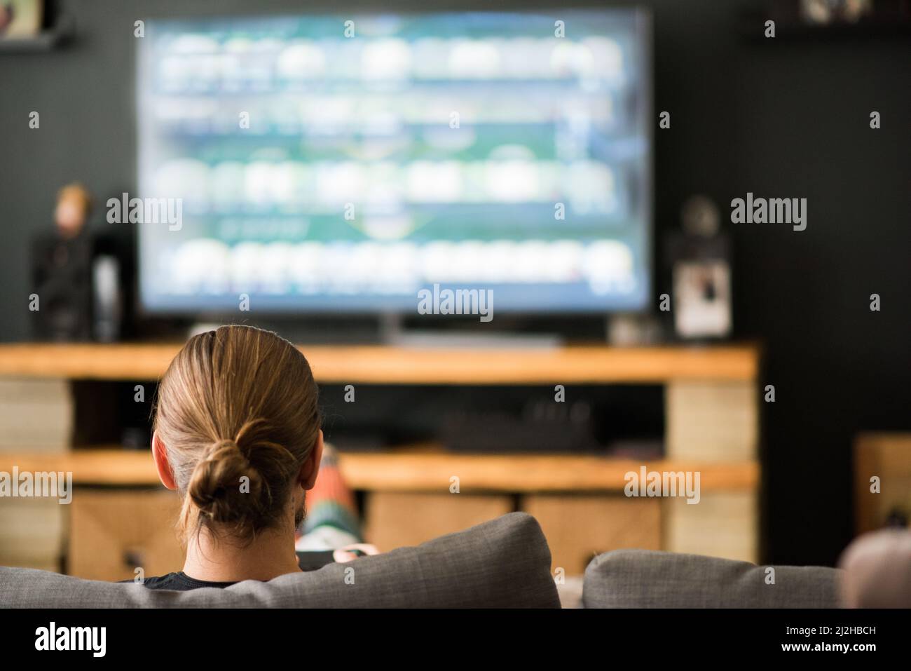 Playing video game rear view hi-res stock photography and images - Alamy