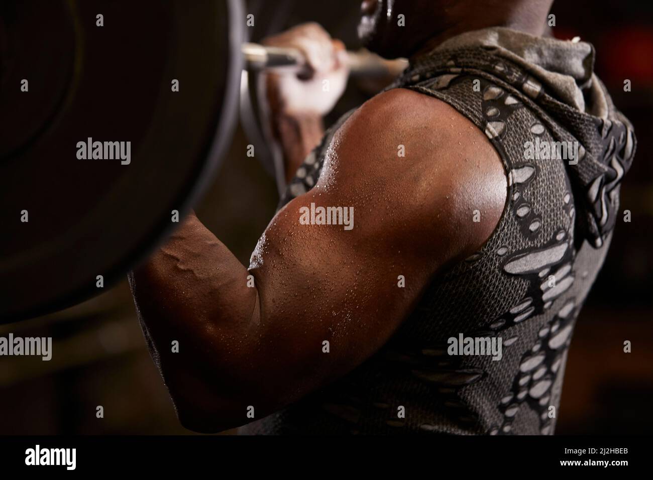Close-up of man weightlifting in gym Stock Photo