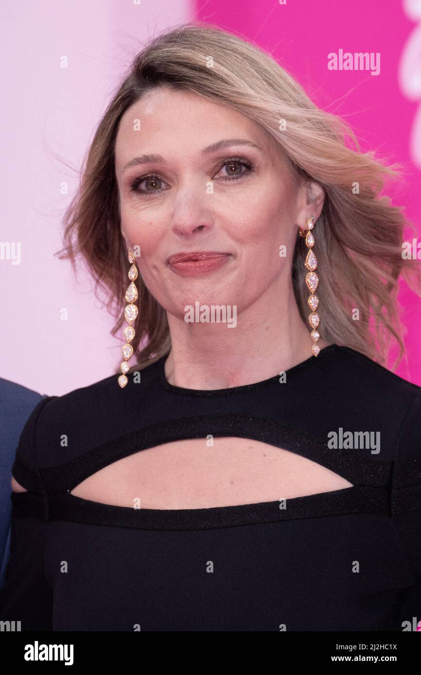 Jury member, Anne Marivin poses on the pink carpet during the opening