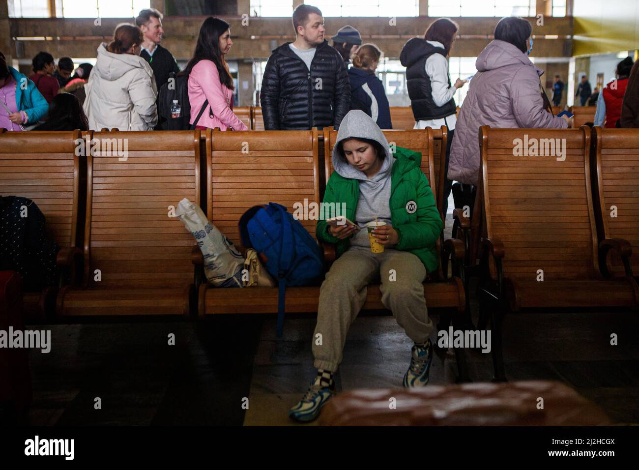 People are seen in the waiting room of the Chop International Railway Station, Zakarpattia, western Ukraine, April 1, 2022. More than four million Ukrainians have now fled the country to escape Russia's 'senseless war', the United Nations said Wednesday.The number of refugees has surpassed UNHCR's initial estimate that the war could create up to four million. The agency says the speed and scale of the displacement is unprecedented in Europe since World War II Photo by Serhii Hudak/Ukrinform/ABACAPRESS.COM Stock Photo