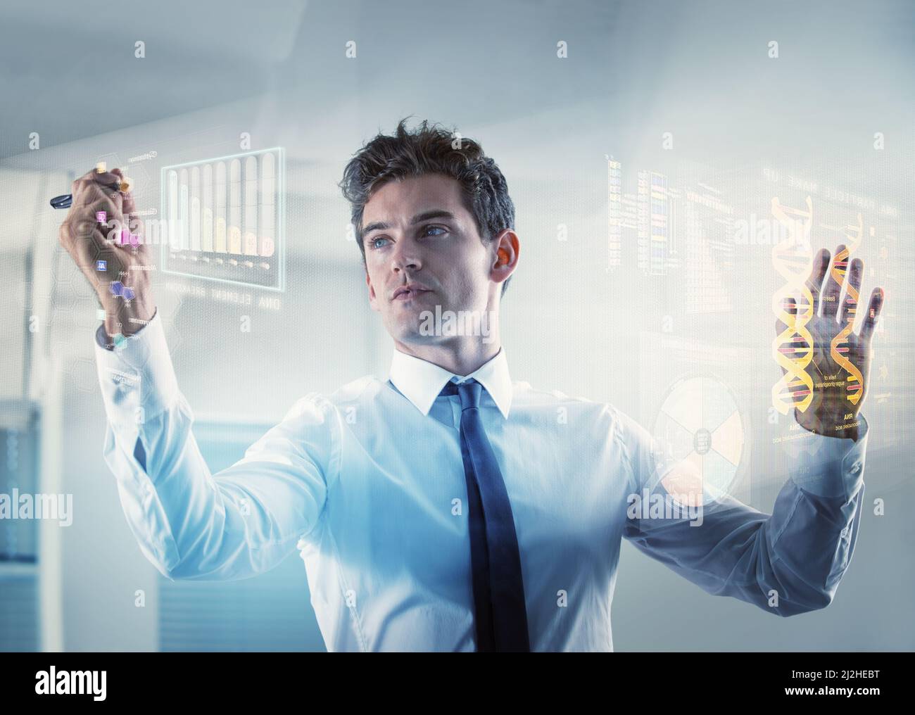 Shot of a young businessman using a cgi digital interface- ALL screen content on this image is created from scratch by Yuri Arcurs team of Stock Photo