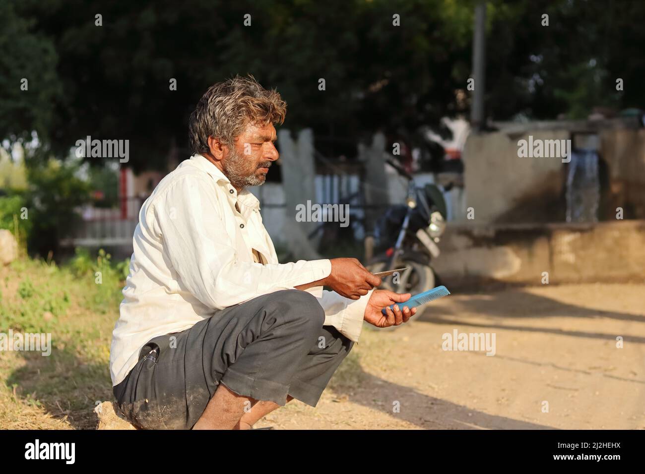 Indian rural old man sitting hi-res stock photography and images - Alamy