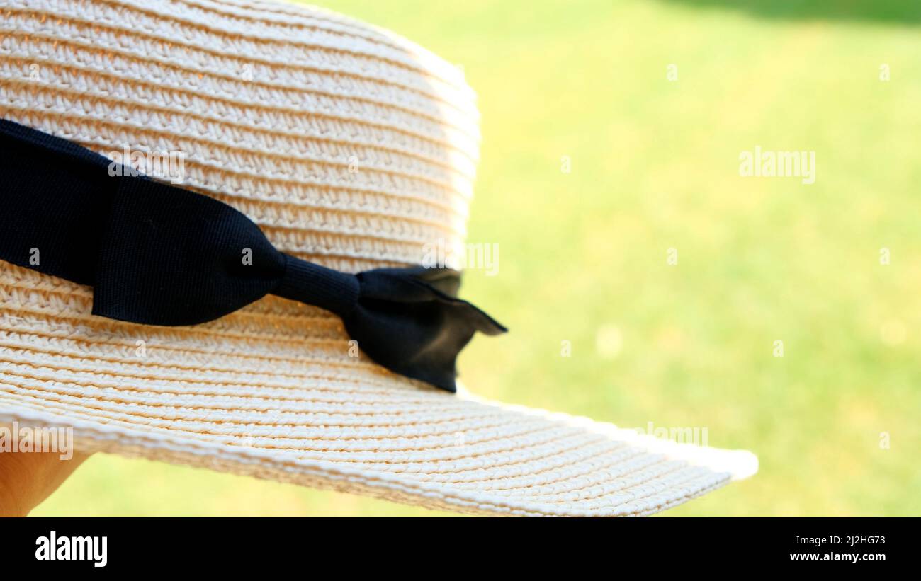 female straw hat against the backdrop of a beautiful blue sky and ...