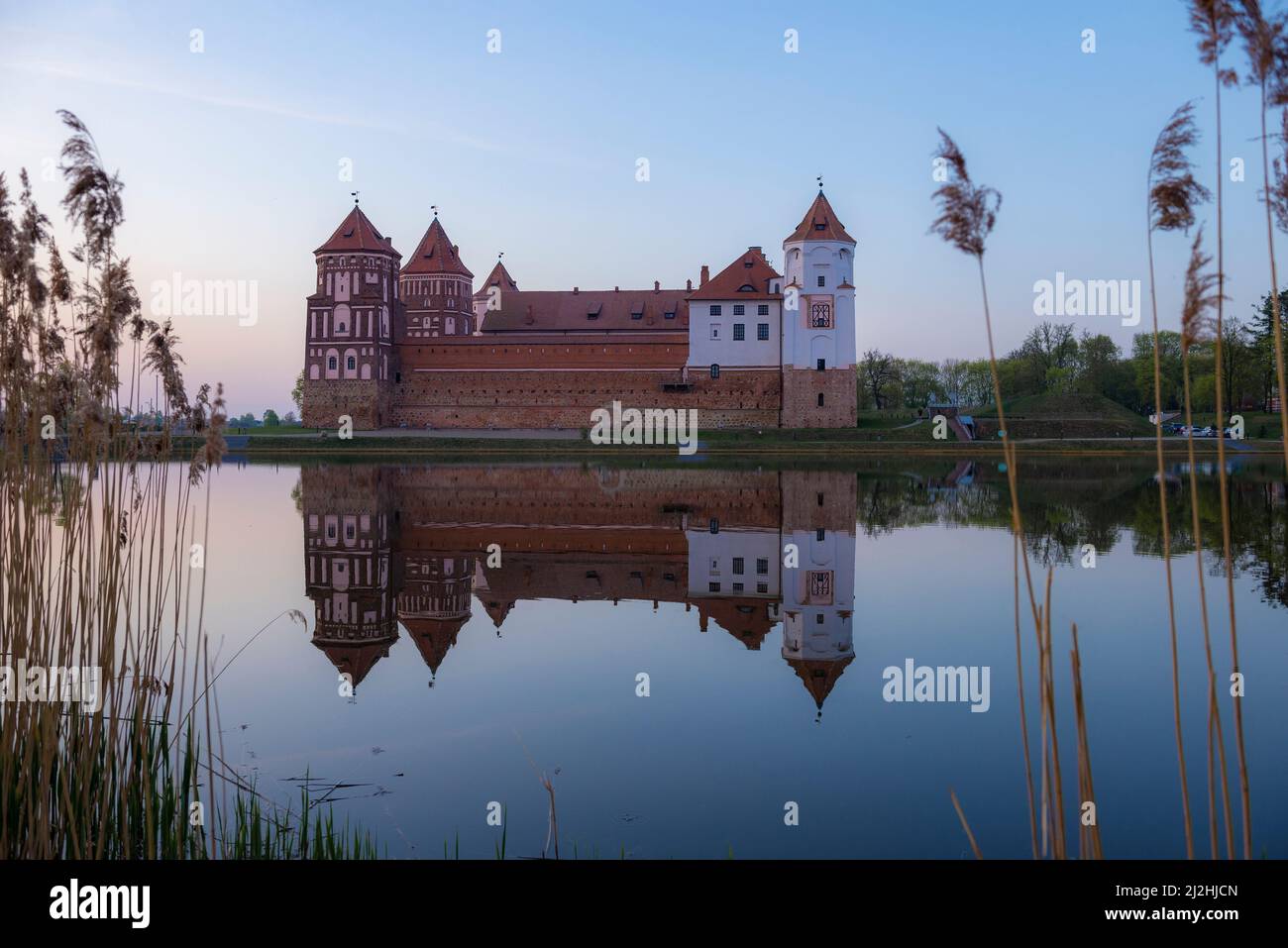 View of the ancient Mir castle in April twilight. Mir, Belarus Stock Photo