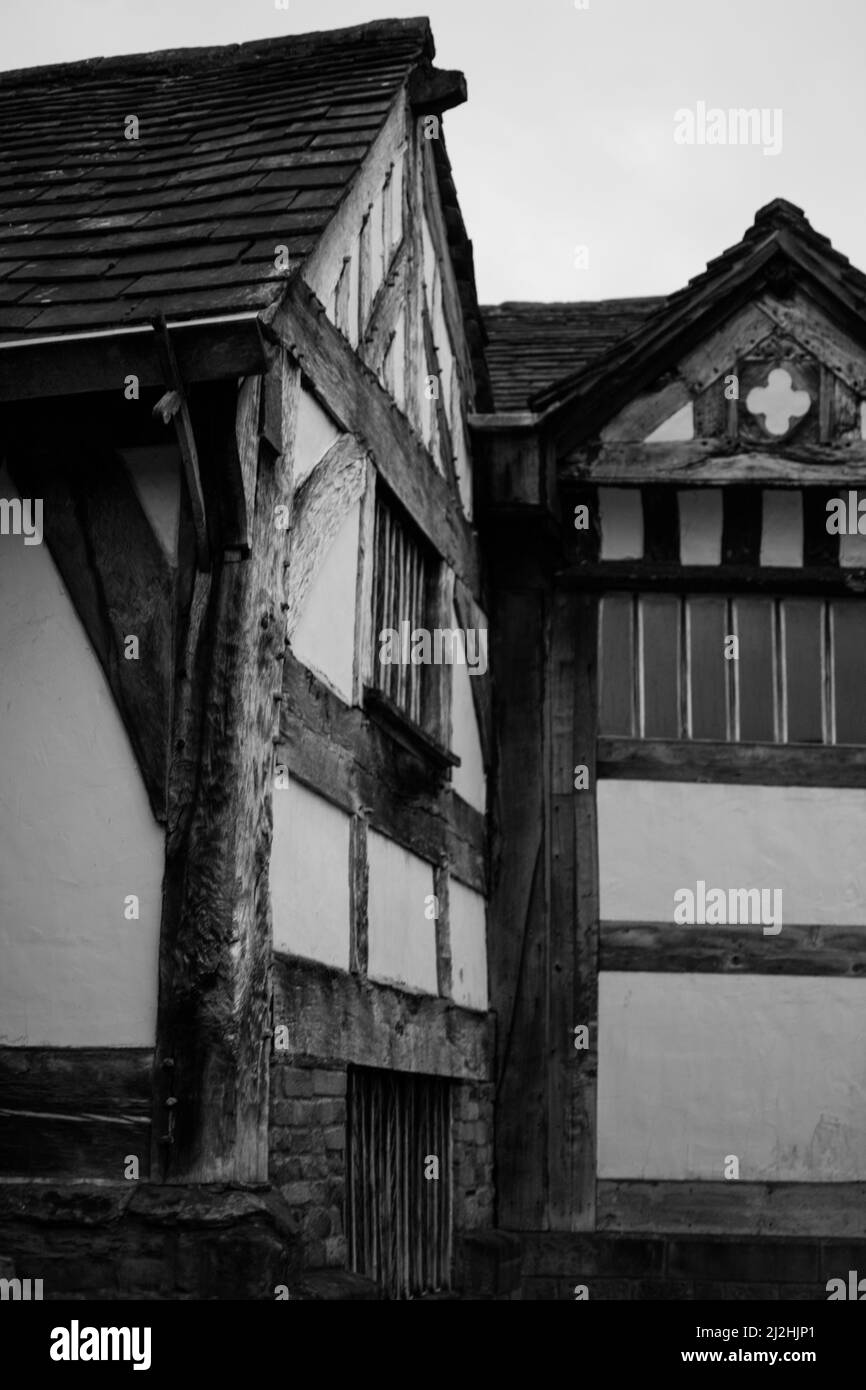 Timber-framed building in a Tudor / medieval style at Smithills Hall, Bolton in Black and White / Monochrome. Stock Photo