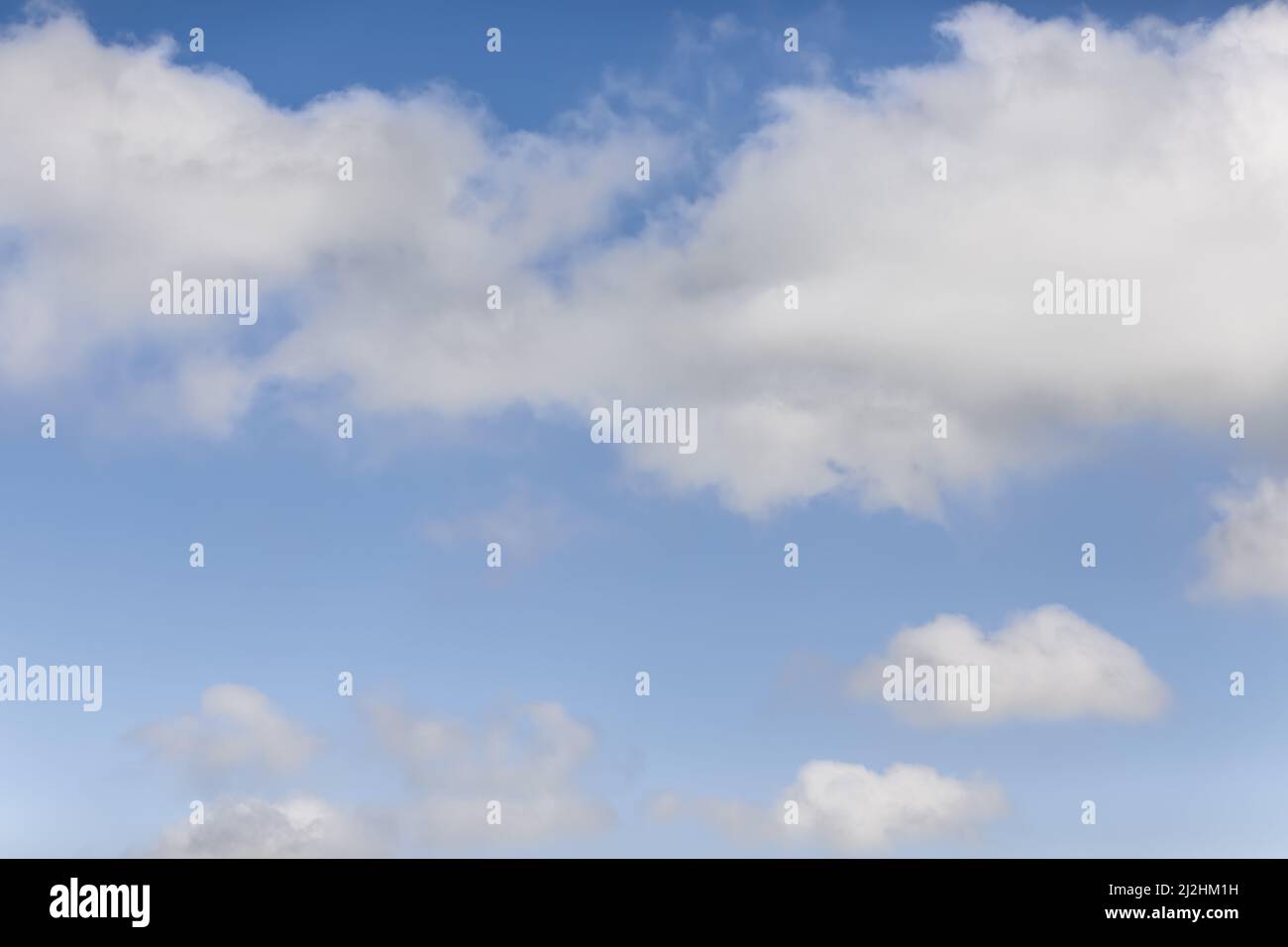 Cumulus and cirrus white clouds on a blue sky background Stock Photo ...