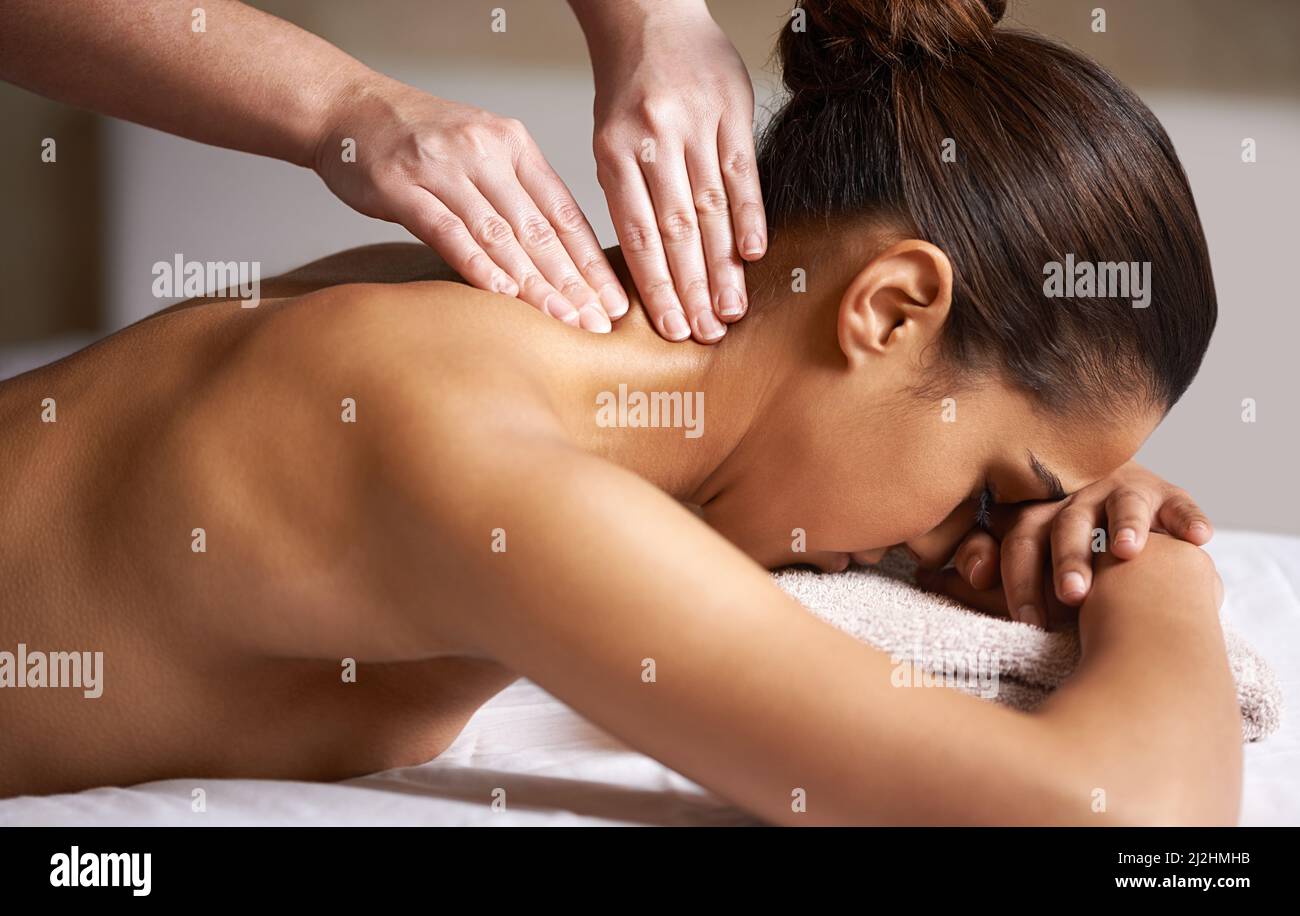Woman receives a neck and shoulder massage available as Framed Prints,  Photos, Wall Art and Photo Gifts