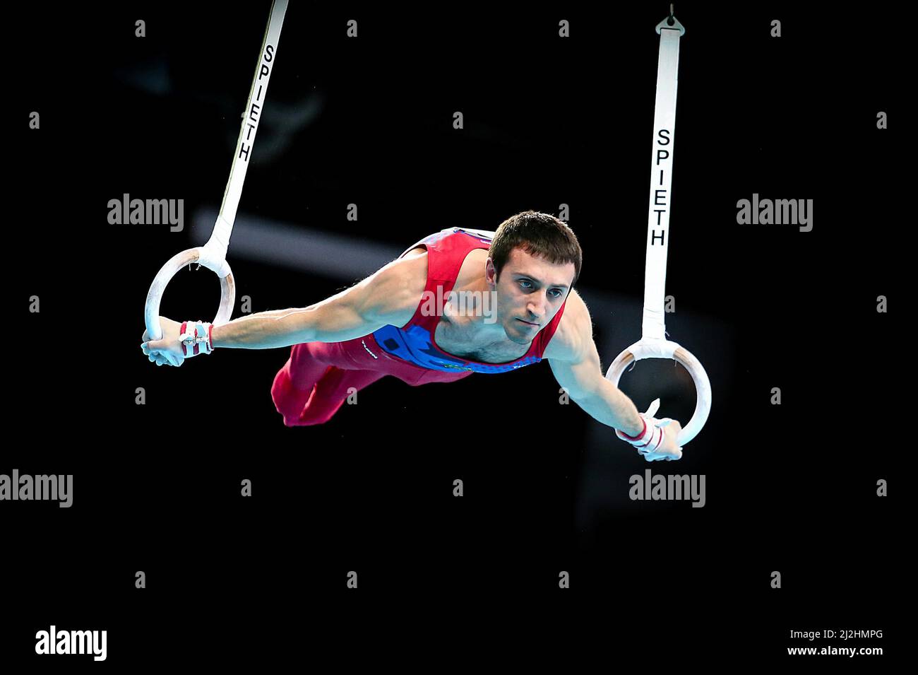 Szczecin, Poland, April 10, 2019: Artur Davtyan of Armenia competes on the rings during the European artistic gymnastics championships Stock Photo
