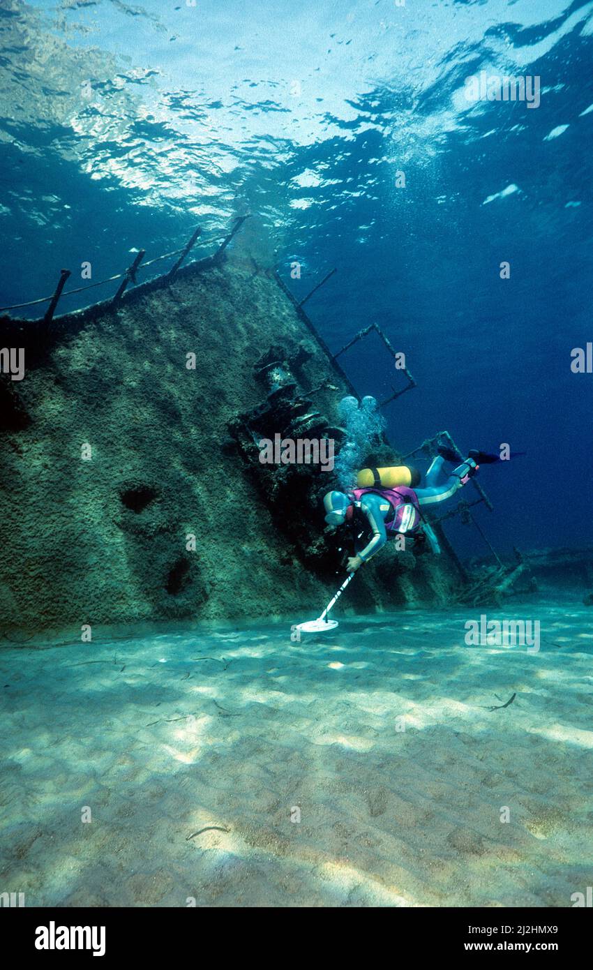 Scuba diver searching with a metal dedector at a sunken shipwreck, Ponza island, Italy Stock Photo