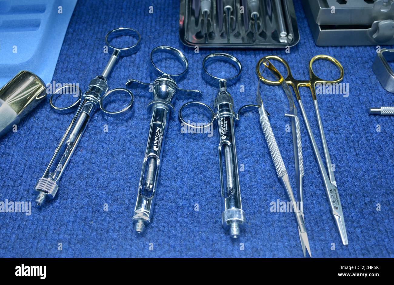 Cartridge syringes and other dental surgery tools, made by Unicorn