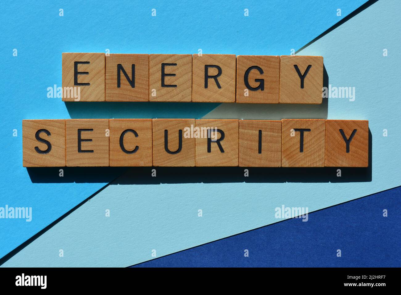 Energy Security, words in wooden alphabet letters isolated on blue background Stock Photo