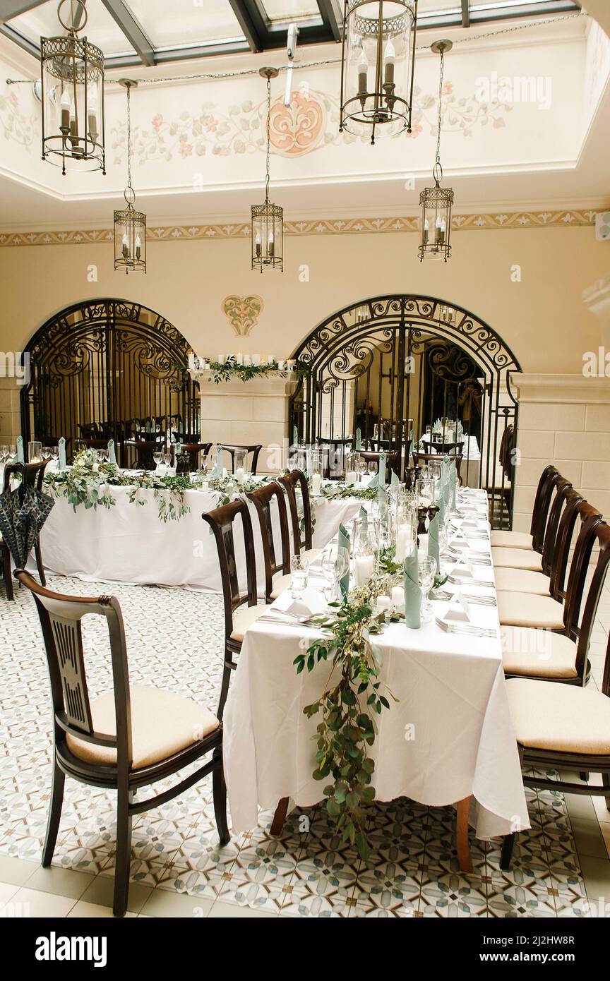 Interior decorated for wedding celebration with natural greenery ...