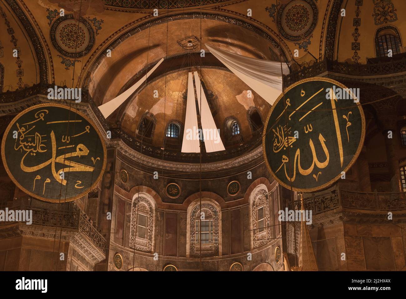 Islamic background photo. Calligraphies of Allah and Prophet Muhammad in Hagia Sophia or Ayasofya. Ramadan or kandil or laylat al-qadr or islamic back Stock Photo