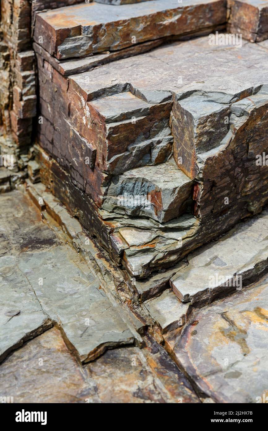 Background Shale rock with layered slate forming banks of Prut river in Carpathians, Ukraine Stock Photo