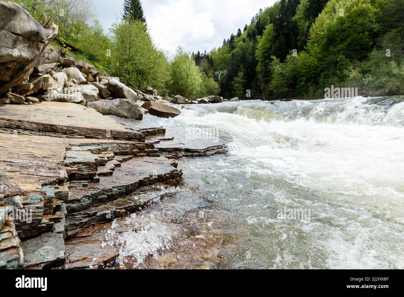 Scenic spring view of fast flowing Prut river near Yaremche in Carpathian region in Ukraine. Travel destinations and nature resorts in Ukraine Stock Photo