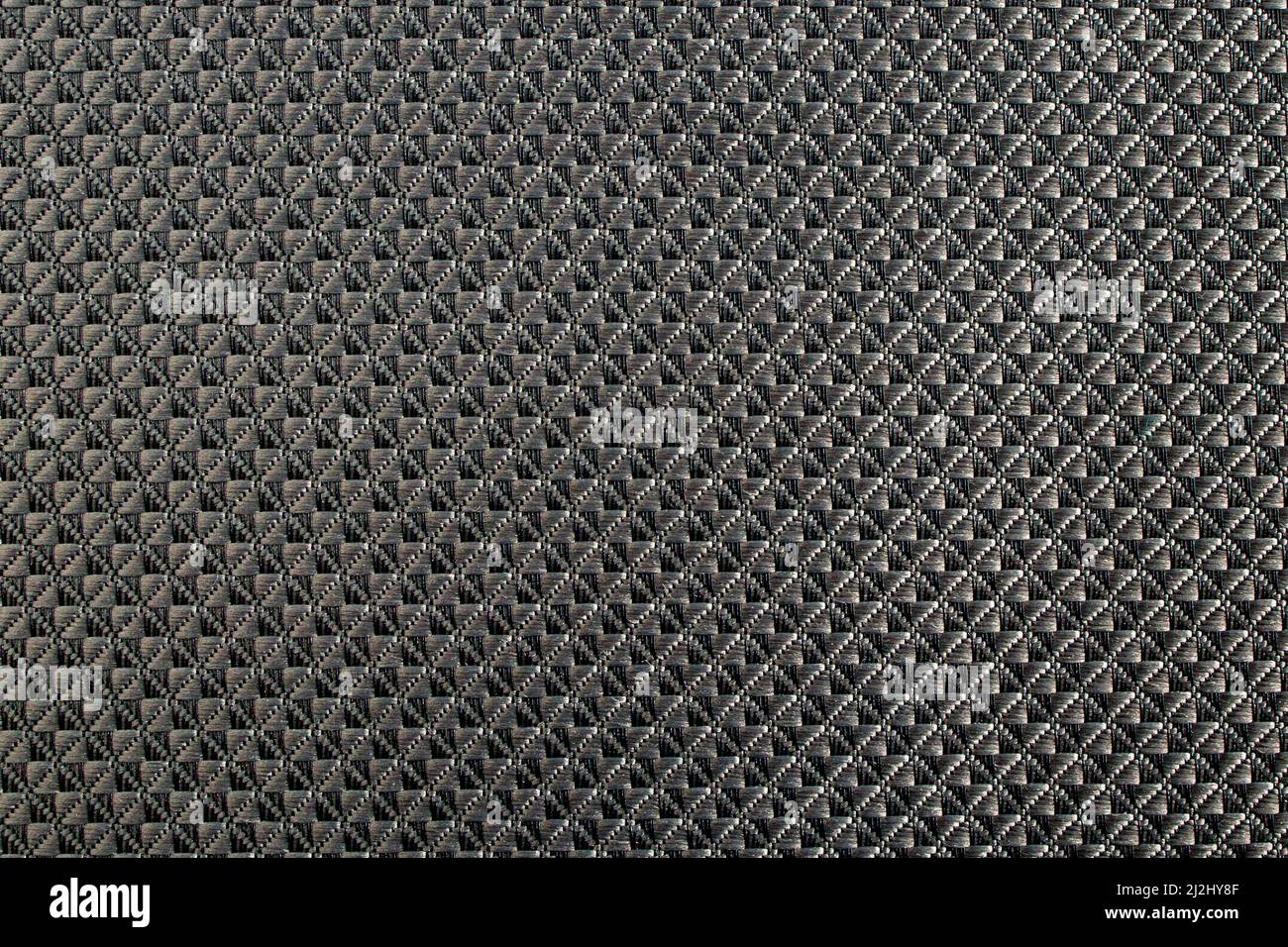 Close up of gray synthetic textured fabric with a rhombus pattern. Template design or polyester material abstract background Stock Photo