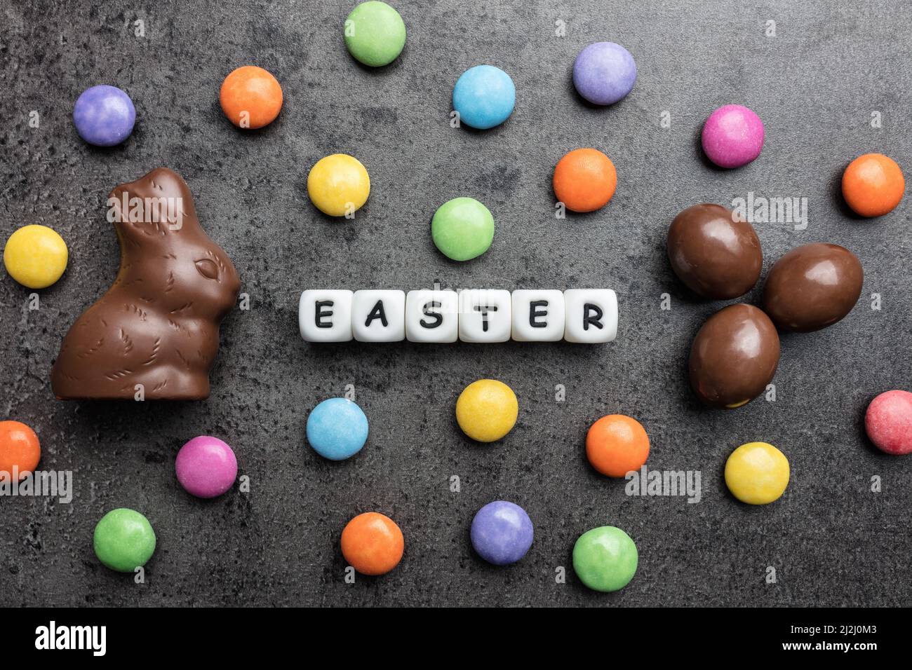 Delicious Easter holiday chocolate bunny, eggs and sweets Stock Photo