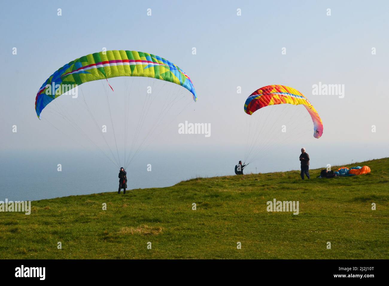 Paragliders at Beachy Head, Eastbourne, East Sussex, UK Stock Photo