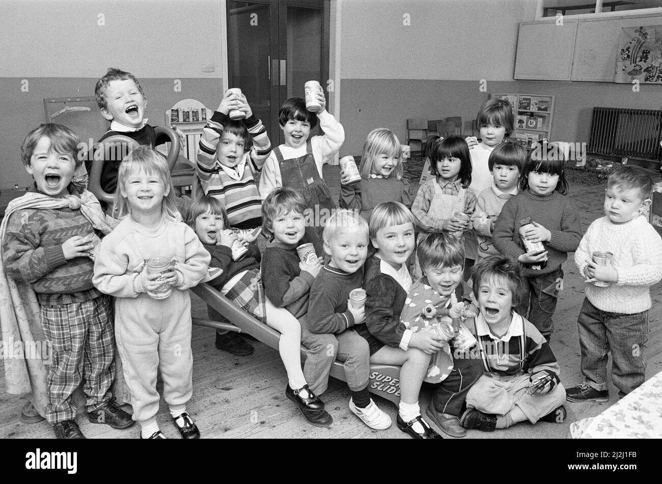 POP stars... Youngsters at the new Gledholt Methodist playgroup are seen with the soft drinks prizes awarded to the group by St Clement's fizzy drinks in a competition run by the Pre-School Playgroups' Association called Play Safe Week.  10th November 1988. Stock Photo
