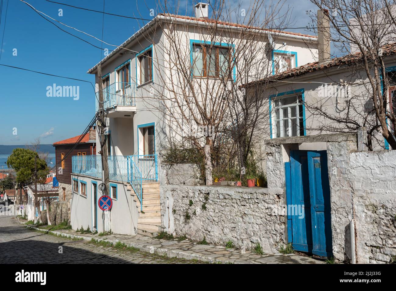 Canakkale, Turkey. February 18th 2022 Pretty blue painted houses in the village of Kilitbahir on the Gallipoli Peninsular overlooking the Dardanelles Stock Photo