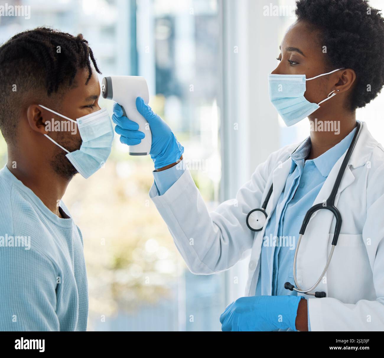 https://c8.alamy.com/comp/2J2J3JF/lets-take-your-temperature-shot-of-a-female-doctor-taking-the-temperature-of-her-patient-2J2J3JF.jpg